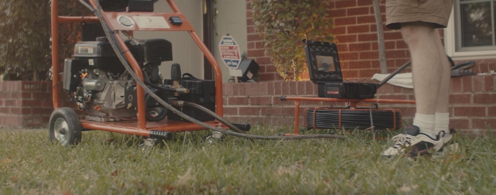 Load video: A demonstration video showing the KC4000 in use. The KC4000 is inserted into a clean-out and can be seen blasting water down a pipe through the view of a Kyrie pipe inspection camera.